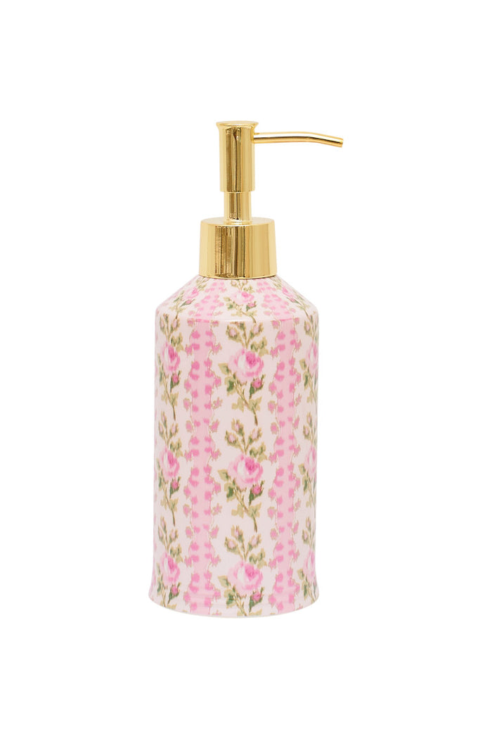 Pink floral lotion dispenser with gold hardware