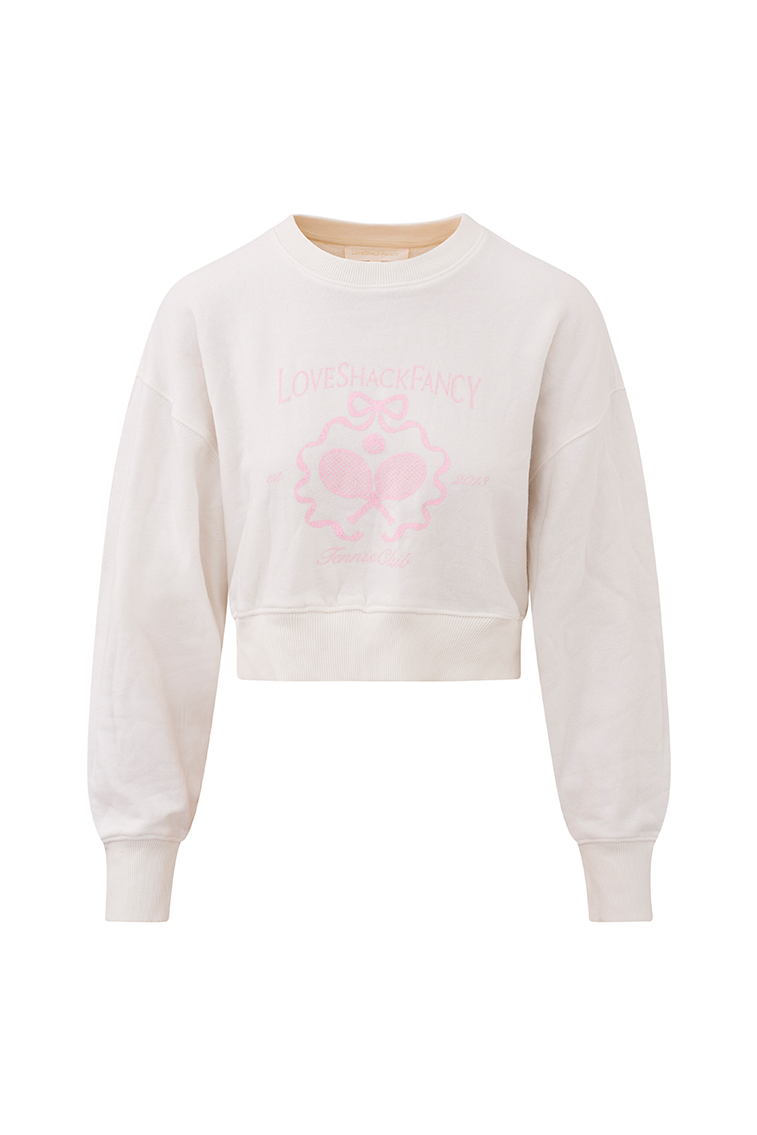 White pullover crew-neck sweater with ribbed sleeve cuffs, neckline, and hem. With a pink LoveShackFancy logo including two tennis raquets.