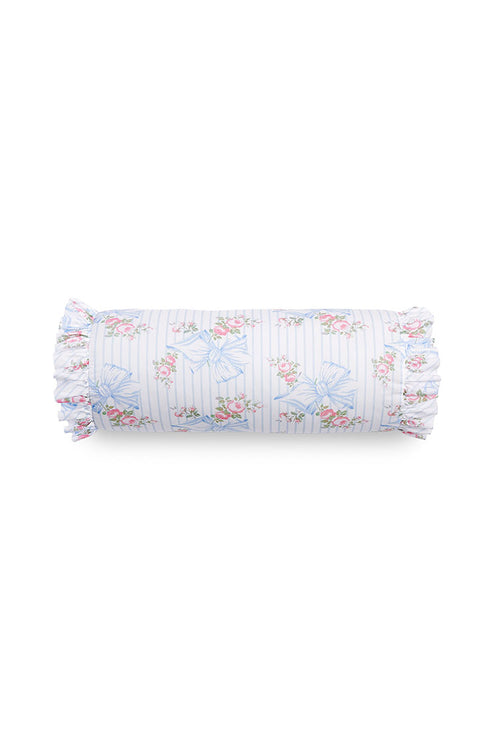 Bolster pillow with ruffle details and a floral bow print.