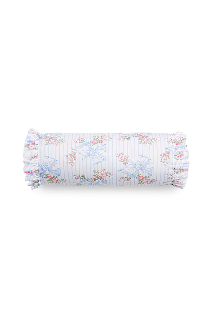 Bolster pillow with ruffle details and a floral bow print.