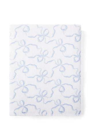 Woven towel with a bow print.