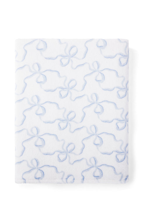 Woven towel with a bow print.