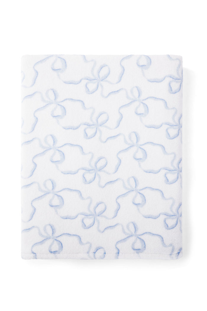 Woven towel with a bow print.