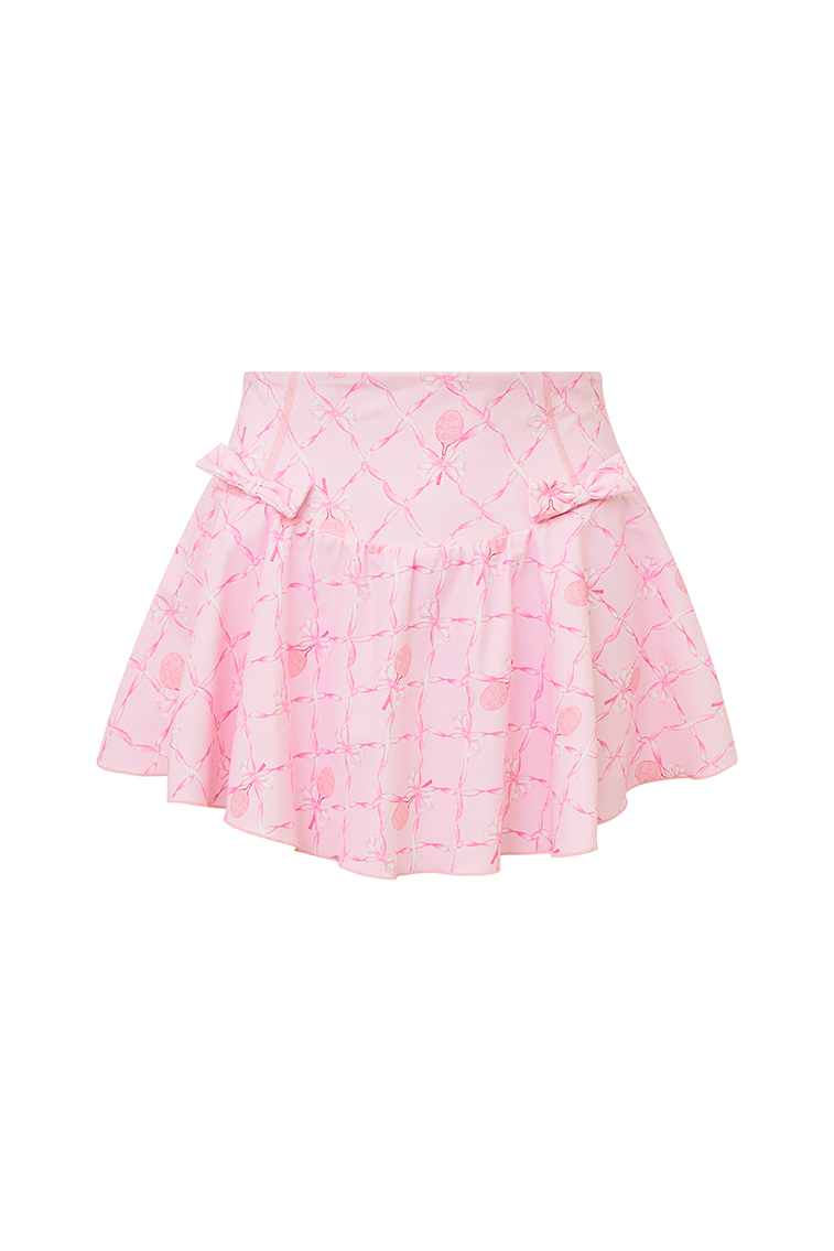 Pink active skort with a bow and tennis raquet pattern. Two pink bows placed on each frontside of hip.