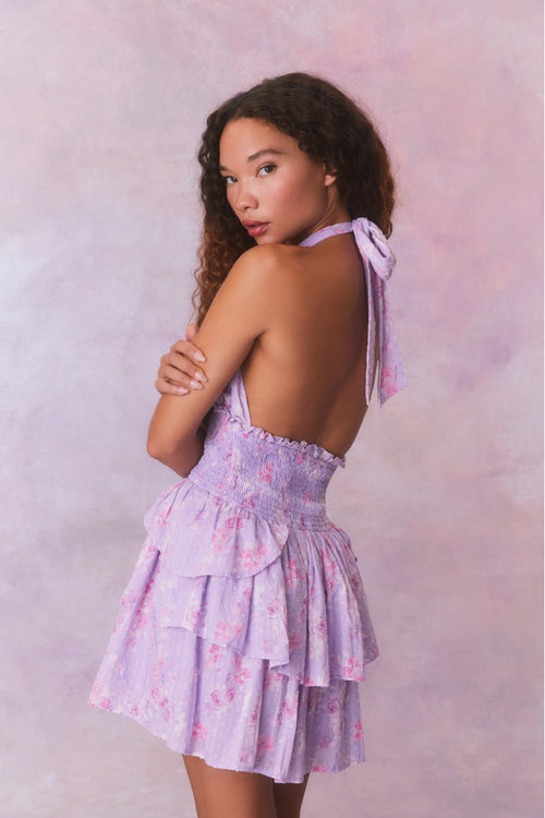 Purple floral low-cut halter dress with a smocked waistband and two ruffled tiers.