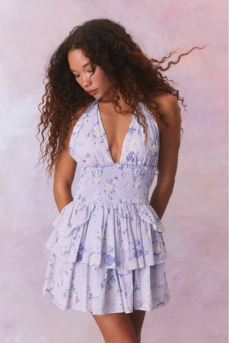 Blue floral low-cut halter dress with a smocked waistband and two ruffled tiers.