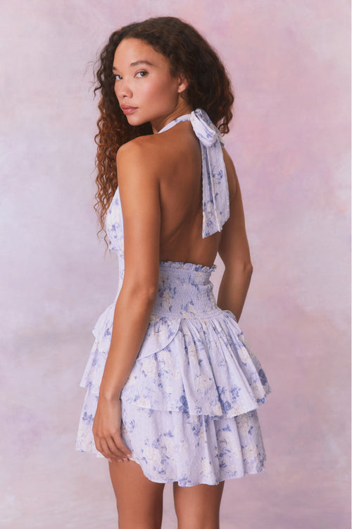 Blue floral low-cut halter dress with a smocked waistband and two ruffled tiers.