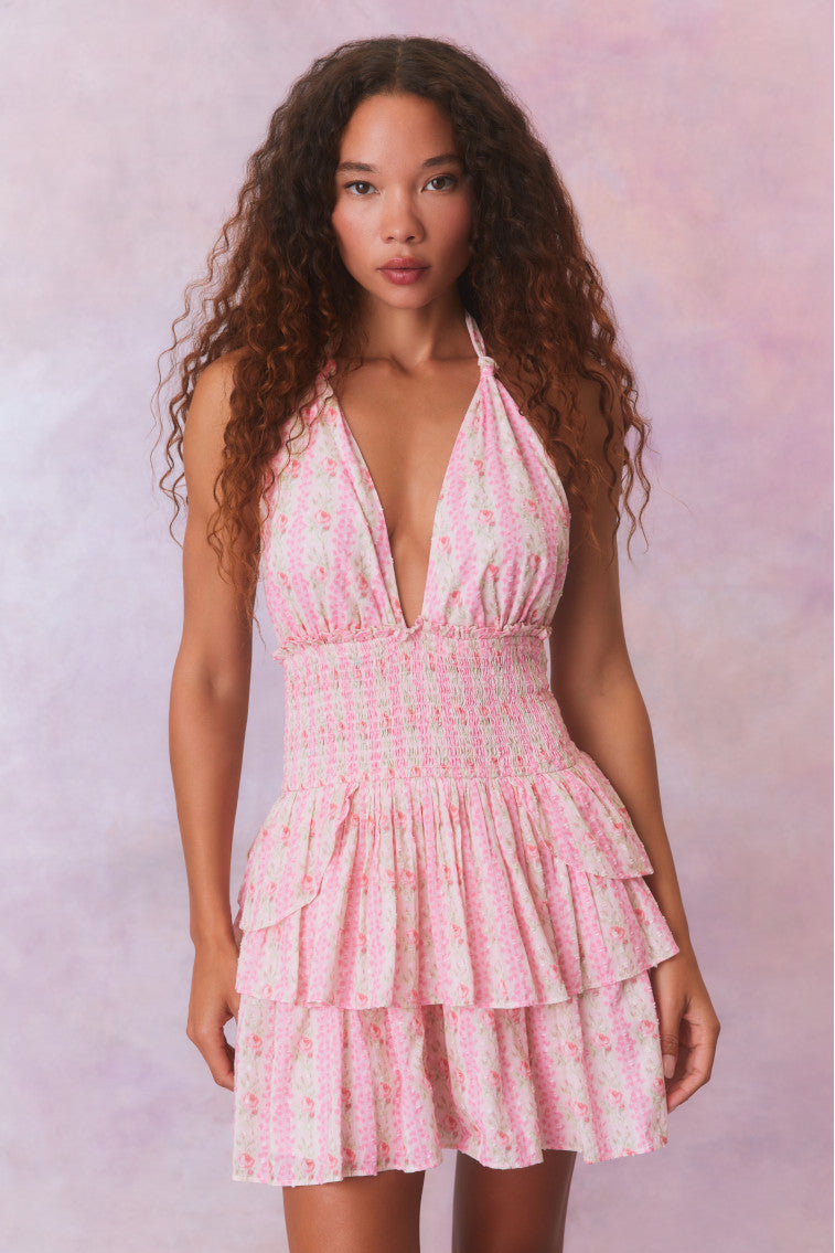 Pink floral low-cut halter dress with a smocked waistband and two ruffled tiers.