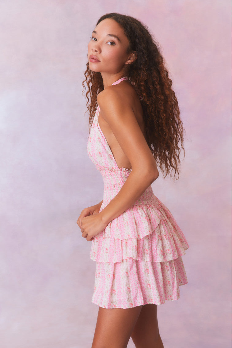 Pink floral low-cut halter dress with a smocked waistband and two ruffled tiers.