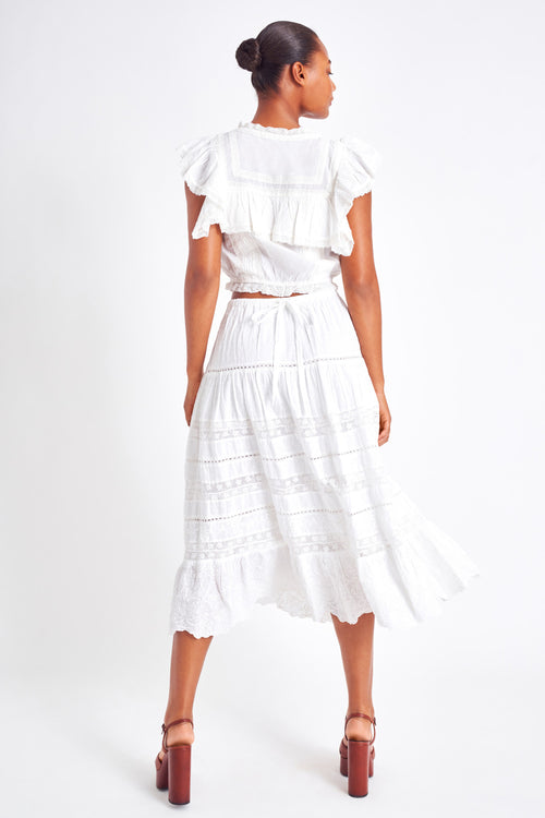 White midi skirt with lace detailing throughout the skirt as well as on the bottom trim