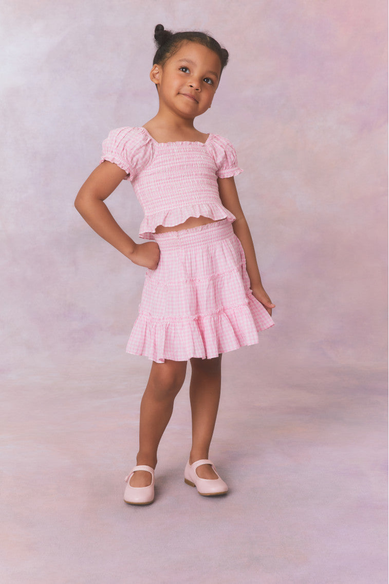 Pink gingham three tiered ruffle skirt, with elastic waistband for girls.