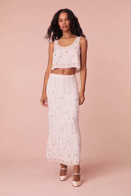 Long skirt with embroidery and beading all over in the form of a zig zag pattern with stars, finished with a fixed waistband.