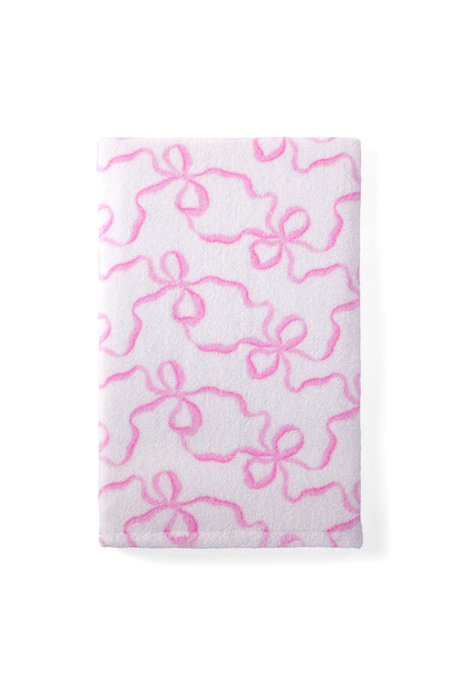 Hand towel with a bow print.