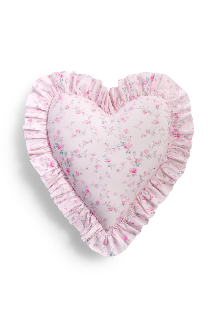 Floral printed heart shape pillow featuring ruffles on each end, a removable insert, and zipper closure.