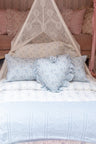 Blue, 100% cotton chic throw blanket. Featuring heart and bow-stripped pointelle details. 