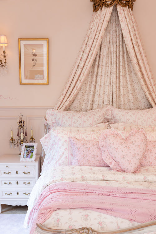 Pink, 100% cotton chic throw blanket. Featuring heart and bow-stripped pointelle details. 