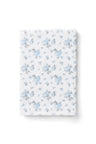 vintage-inspired delicate repeating mini floral print bath towel in a soft blue against a white back