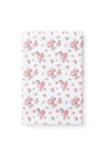 vintage-inspired delicate repeating mini floral print bath towel in a soft pink against a white back