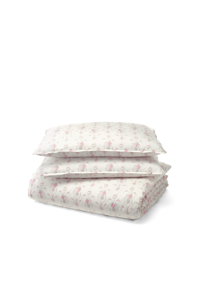 Delicate pink floral pattern against a pristine white Pillow. Crafted from 100% cotton