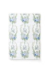 vintage-inspired repeating floral print bath towel in a soft blue against a white back