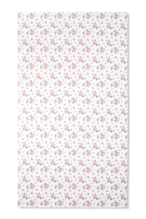 vintage-inspired repeating floral print bath towel in a soft pink against a white back