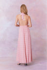 Pink floral halter maxi dress that ties in the back, flowing into an airy skirt.