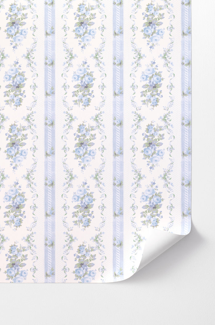 This design showcases beautiful baby blue floral prints delicately scattered across a pristine white backdrop. Adding to its visual appeal, a subtle blue strip elegantly separates the floral patterns, creating a sense of depth and space.