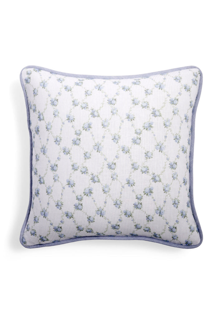 Throw pillow with a blue floral print.