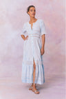 Blue cotton maxi dress with floral and lace detail, with buttons down center front, quarter length sleeves, a fixed waist, and a full sweeping skirt.