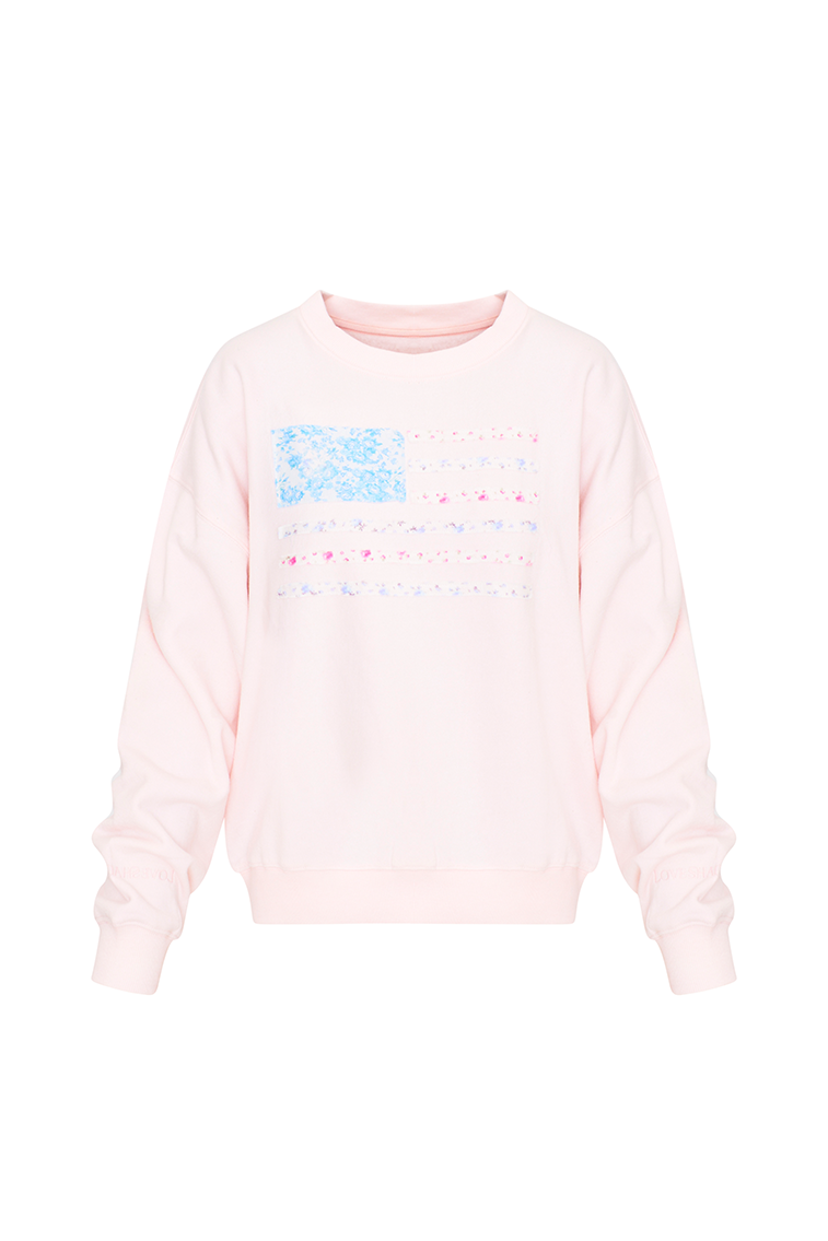 Pink fleece pullover with a custom, floral printed American flag applique embroidered on the front.