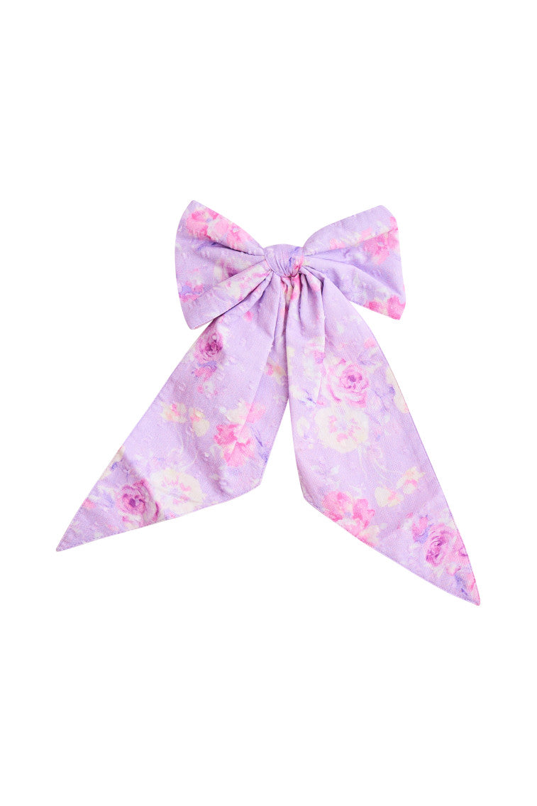 Purple floral bow clip-in.