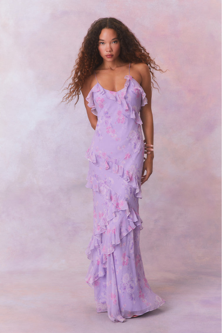 Purple floral chiffon maxi dress with spaghetti straps and ruffles that descend into the maxi skirt.