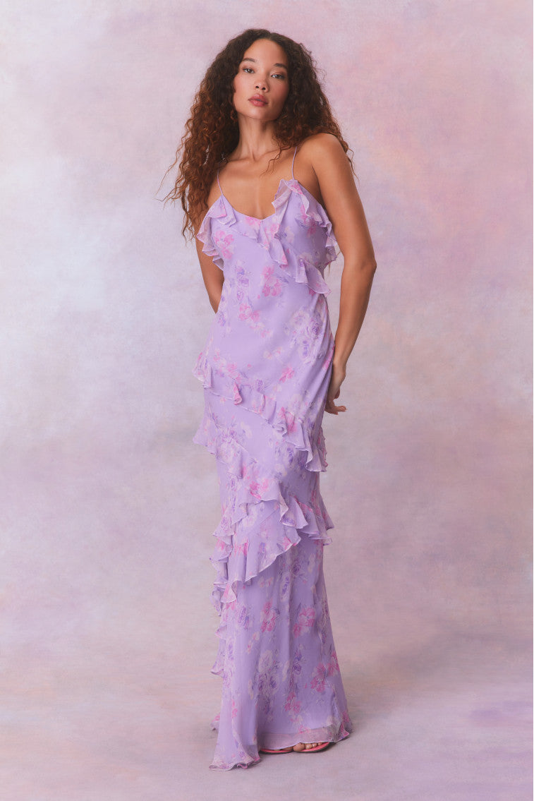 Purple floral chiffon maxi dress with spaghetti straps and ruffles that descend into the maxi skirt.