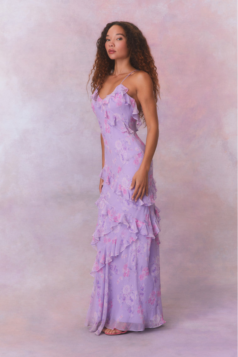 Purple floral chiffon maxi dress with spaghetti straps and ruffles that descend into the maxi skirt.