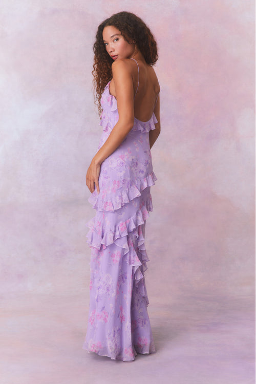 Purple floral chiffon maxi dress with spaghetti straps and ruffles that descend into the maxi skirt.