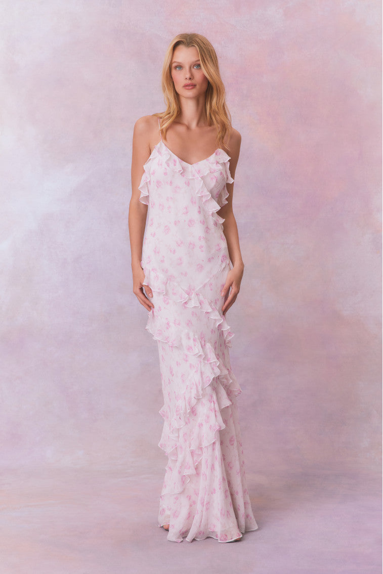 White floral chiffon maxi dress with spaghetti straps and ruffles that descend into the maxi skirt.