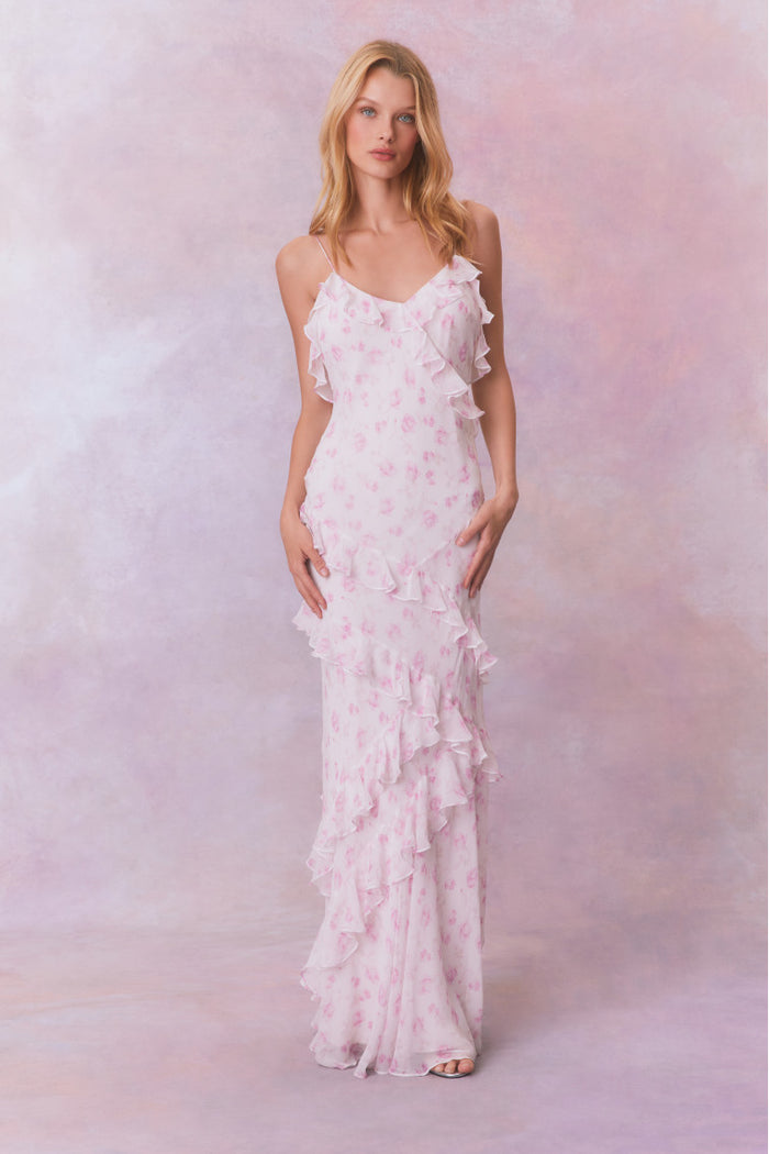 White floral chiffon maxi dress with spaghetti straps and ruffles that descend into the maxi skirt.