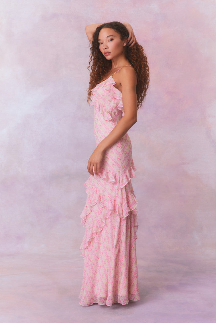 Pink floral chiffon maxi dress with spaghetti straps and ruffles that descend into the maxi skirt.