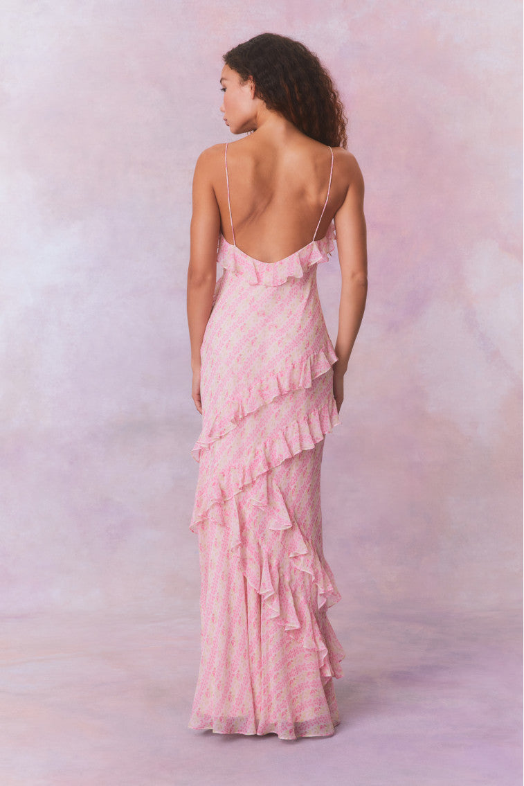Pink floral chiffon maxi dress with spaghetti straps and ruffles that descend into the maxi skirt.