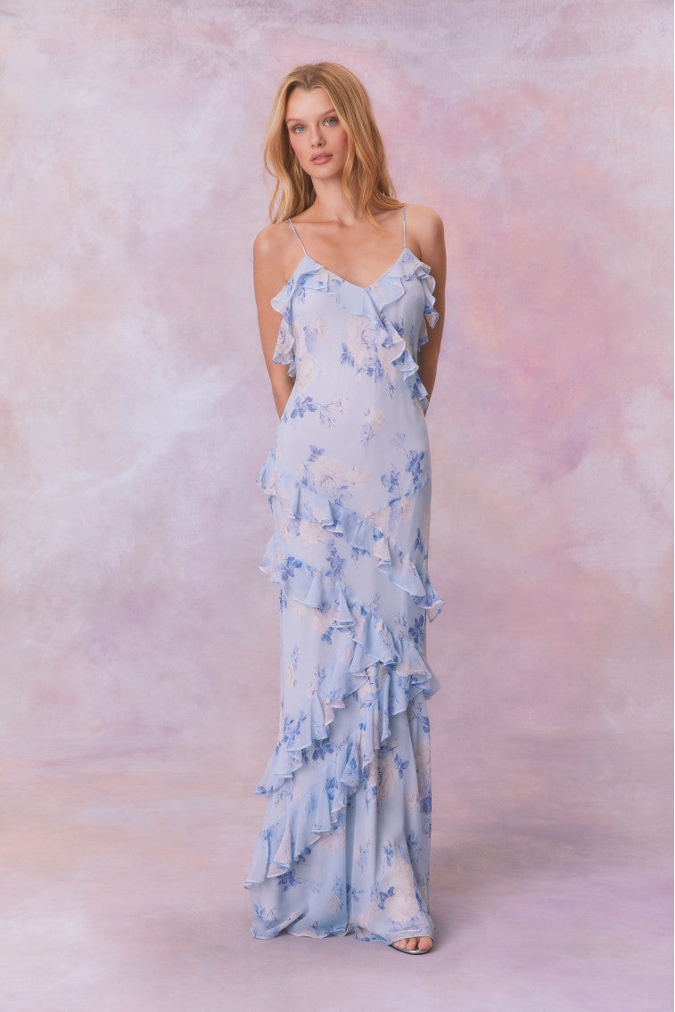 Blue floral chiffon maxi dress with spaghetti straps and ruffles that descend into the maxi skirt.