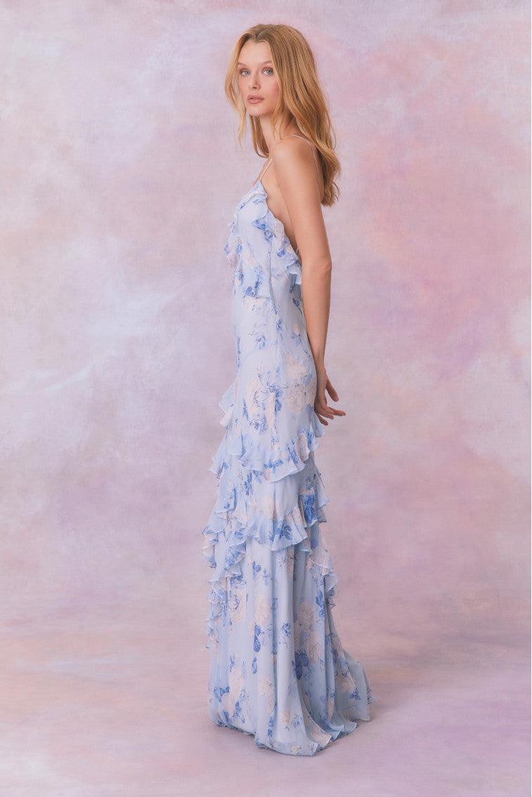 Blue floral chiffon maxi dress with spaghetti straps and ruffles that descend into the maxi skirt.