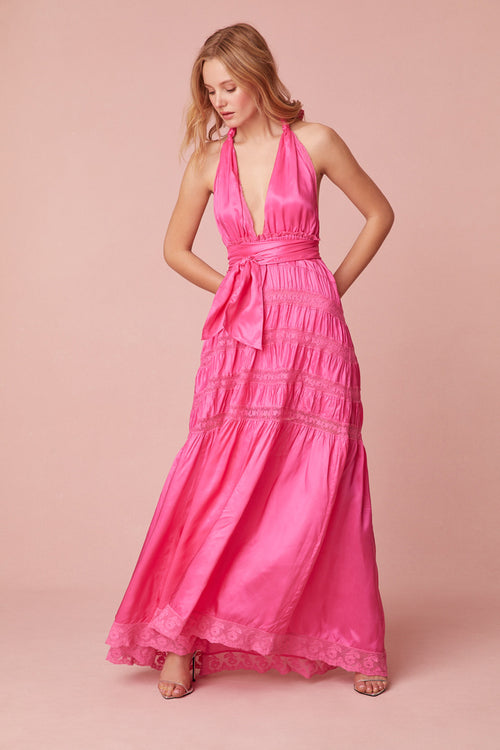 Pink maxi dress with a viscose fabric with laces and textural shirring details all over. Features a deep v-neck, an elasticated waist, and a dramatic skirt with shirring details.