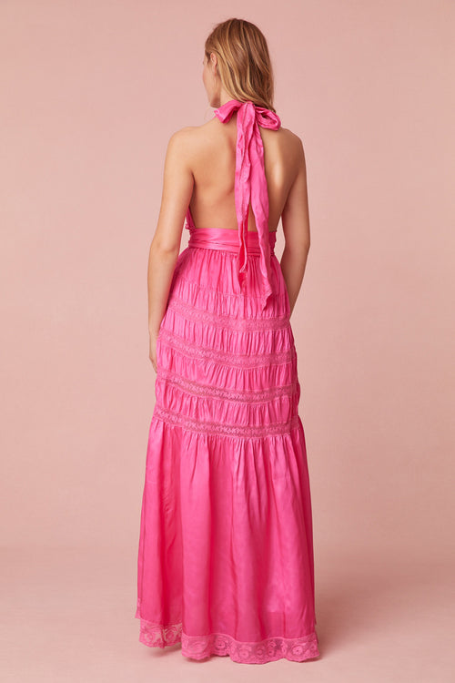 Pink maxi dress with a viscose fabric with laces and textural shirring details all over. Features a deep v-neck, an elasticated waist, and a dramatic skirt with shirring details.