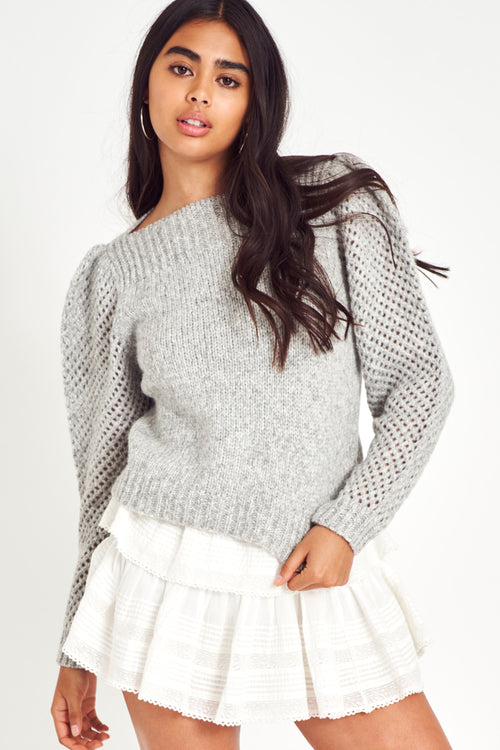 The Rosie pullover is made from baby alpaca while being extremely light and full with a chunky look. It has a straight rib neckline and a straight body with rib finishing. It is an open knit weave with a puffy shoulder that slims out at the bottom.