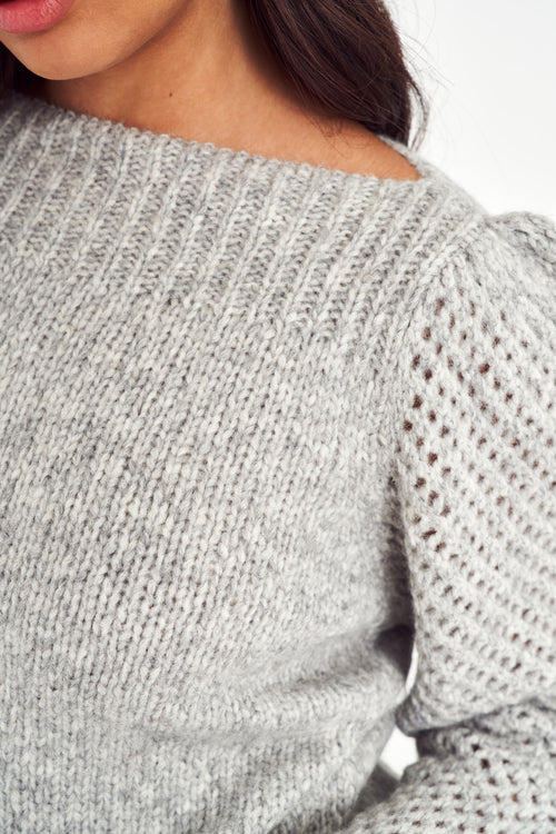 The Rosie pullover is made from baby alpaca while being extremely light and full with a chunky look. It has a straight rib neckline and a straight body with rib finishing. It is an open knit weave with a puffy shoulder that slims out at the bottom.