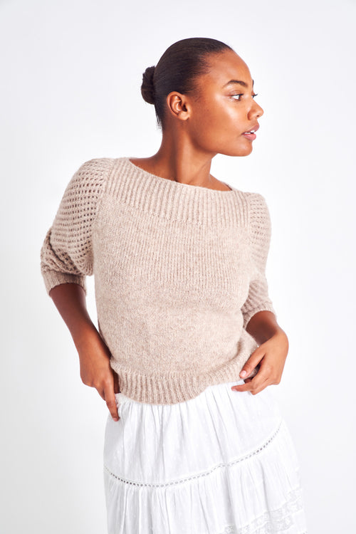 The Rosie oatmeal pullover is made from baby alpaca while being extremely light and full with a chunky look. It has a straight rib neckline and a straight body with rib finishing. It is an open knit weave with a puffy shoulder that slims out at the bottom. 